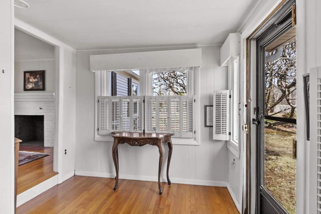 156 R North Street Medfield, MA 02052 - Photo 4 of 17 a view of a hallway with wooden floor and dining room view
