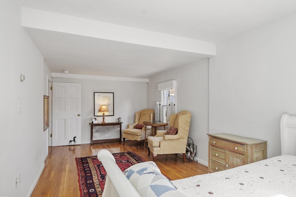 156 R North Street Medfield, MA 02052 - Photo 8 of 17 a bedroom with a bed and wooden floor