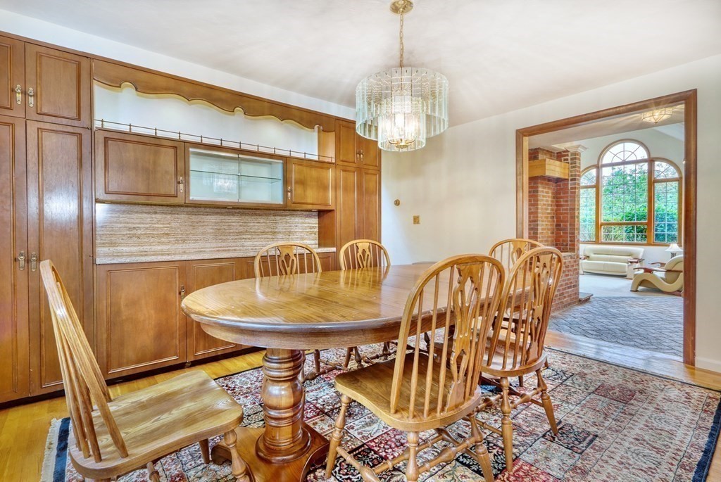 11 Viking Road Winchester, MA 01890 - Photo 11 of 41 a view of a dining room with furniture wooden floor and chandelier