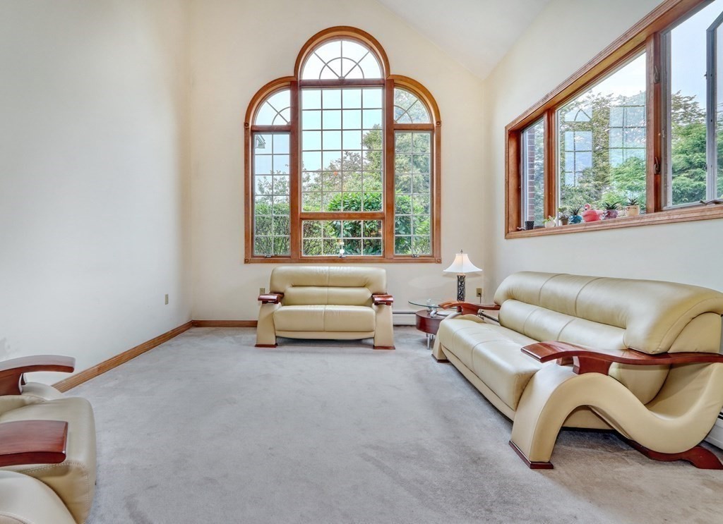 11 Viking Road Winchester, MA 01890 - Photo 13 of 41 a living room with furniture and a large window