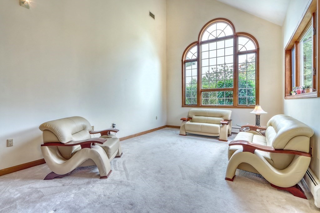 11 Viking Road Winchester, MA 01890 - Photo 14 of 41 a living room with furniture and a window