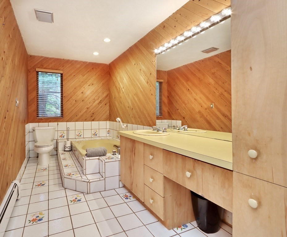 11 Viking Road Winchester, MA 01890 - Photo 15 of 41 a bathroom with a sink mirror and vanity