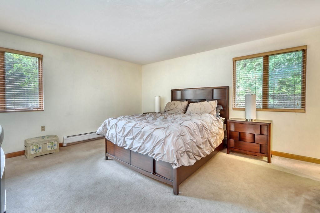 11 Viking Road Winchester, MA 01890 - Photo 16 of 41 a large bed sitting in a bedroom next to a window