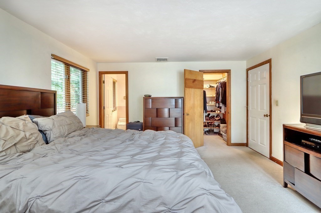 11 Viking Road Winchester, MA 01890 - Photo 17 of 41 a bedroom with a bed and a television