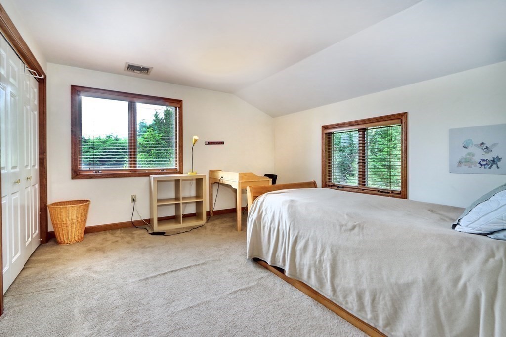 11 Viking Road Winchester, MA 01890 - Photo 28 of 41 a bed sitting in a bedroom next to a window