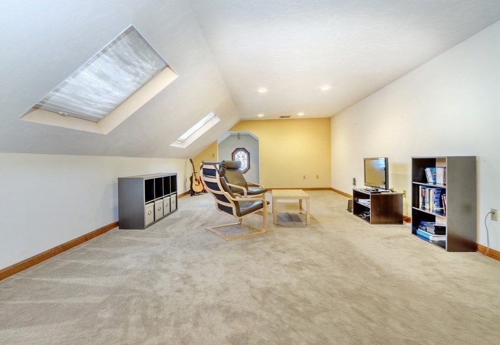11 Viking Road Winchester, MA 01890 - Photo 29 of 41 a view of a livingroom with a fireplace and a large window