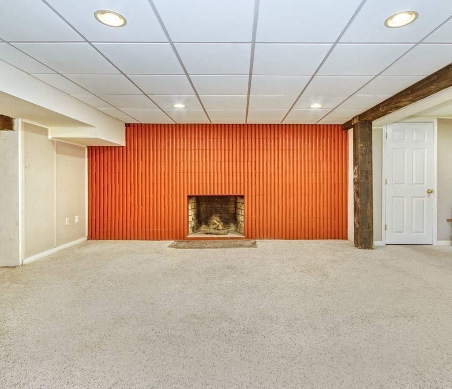 11 Viking Road Winchester, MA 01890 - Photo 32 of 41 an empty room with a fireplace