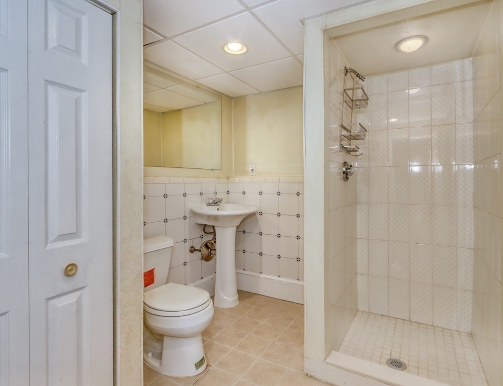 11 Viking Road Winchester, MA 01890 - Photo 33 of 41 a bathroom with a sink a toilet and shower