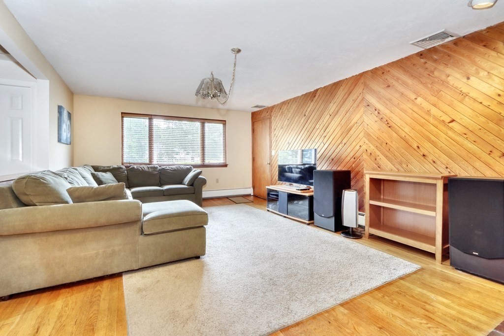 11 Viking Road Winchester, MA 01890 - Photo 4 of 41 a living room with furniture and a flat screen tv