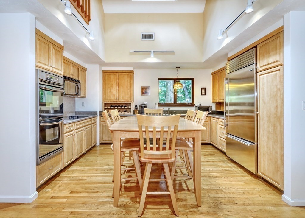 11 Viking Road Winchester, MA 01890 - Photo 6 of 41 a view of a kitchen with granite countertop stainless steel appliances and white cabinets