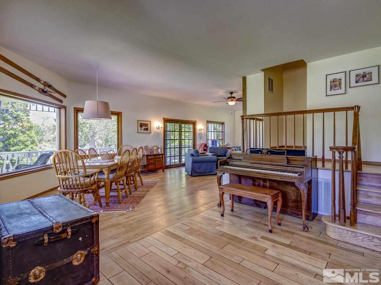 4045 Fairview Road Reno, NV 89511 - Photo 5 of 24 a living room with furniture a wooden floor and a window