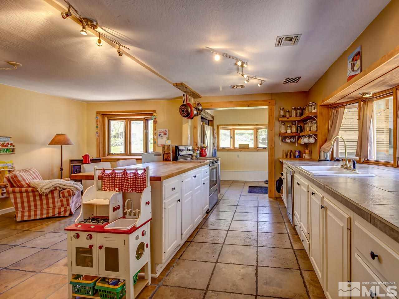 4045 Fairview Road Reno, NV 89511 - Photo 7 of 24 a large spacious bathroom with stainless steel appliances a sink and a large mirror