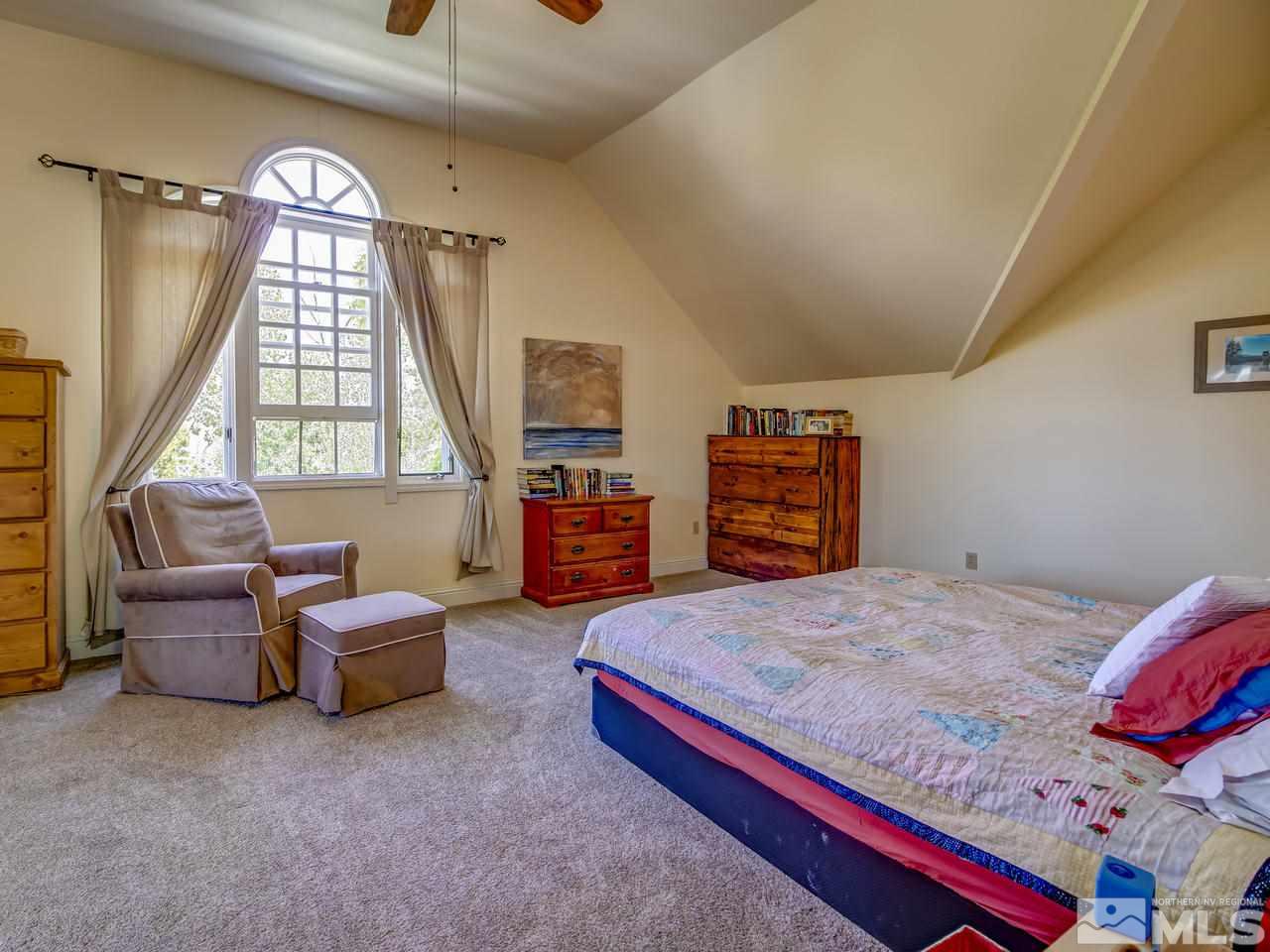 4045 Fairview Road Reno, NV 89511 - Photo 10 of 24 a bedroom with a bed and a couch