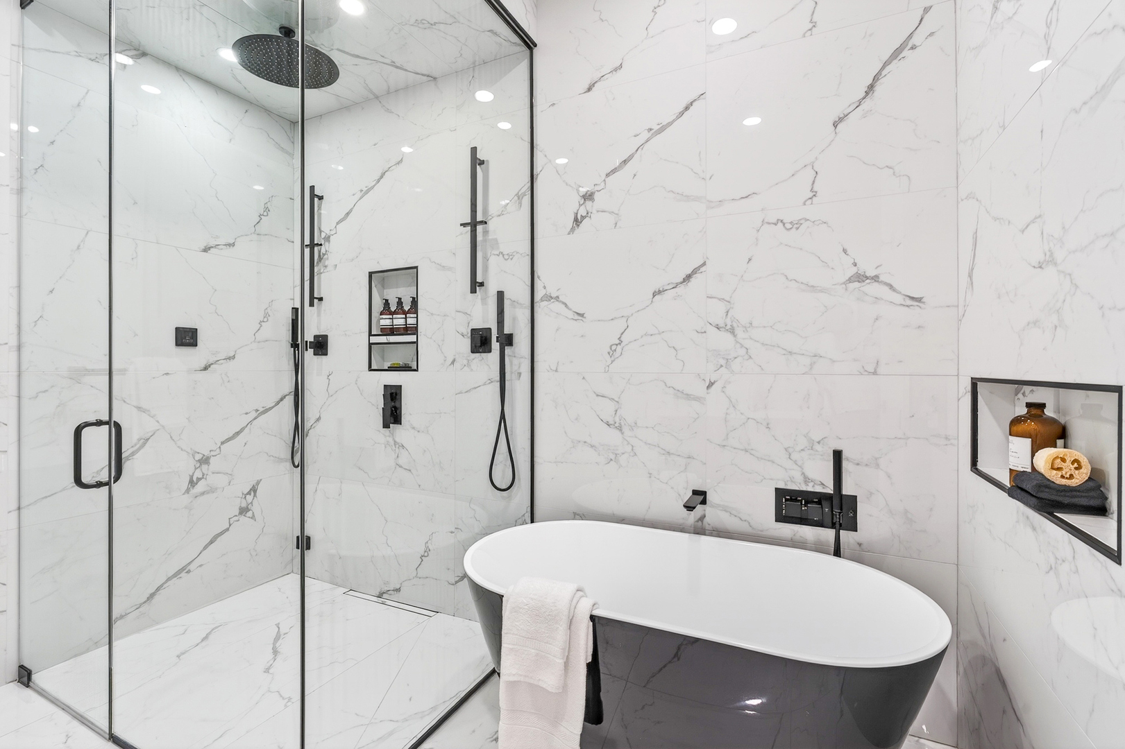 2024 West Irving Park Road, Unit 302 Chicago, IL 60618 - Photo 17 of 32 a bathroom with a bathtub and a shower