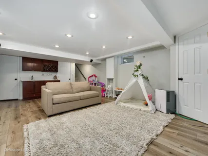 a living room with furniture and white walls