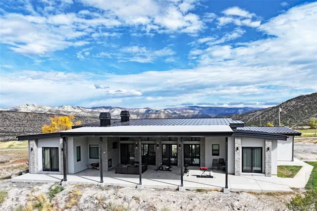 a view of a terrace with a barbeque
