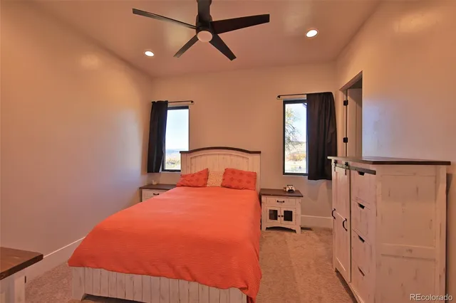 a bedroom with a bed and a mirror