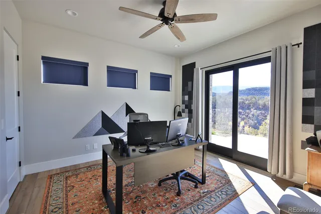 a workspace with furniture and a window