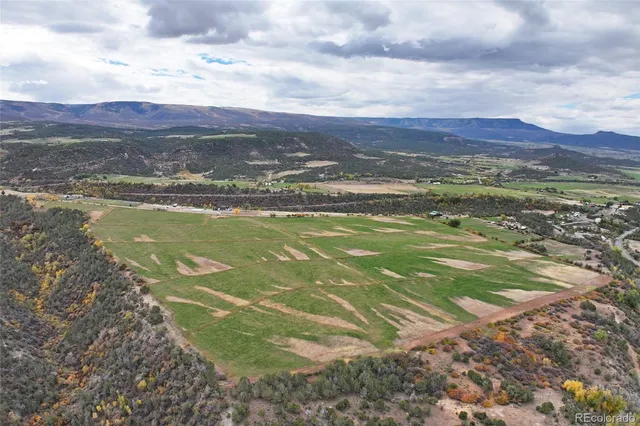 a view of a city with mountains in the background