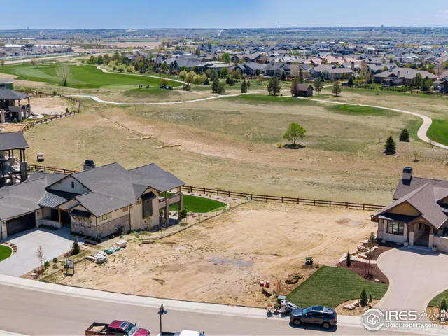 an aerial view of a house with a lake view