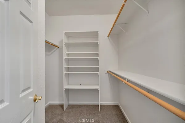 a view of an empty walk in closet