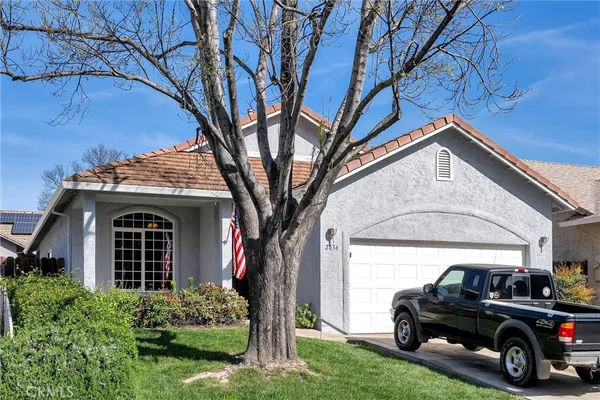 a view of a car parked in front of a house