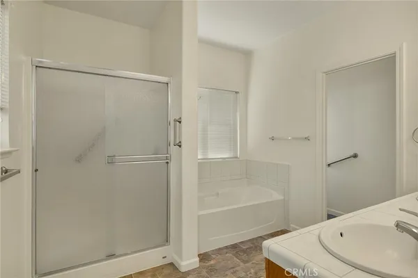 a bathroom with a bathtub and a shower