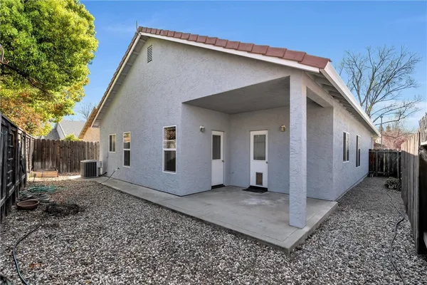 a backyard of a house with wooden fence