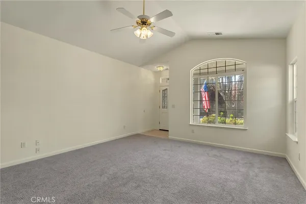 a view of an empty room with a window