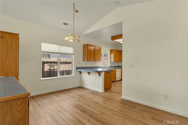 a view interior of a house and kitchen with wooden floor