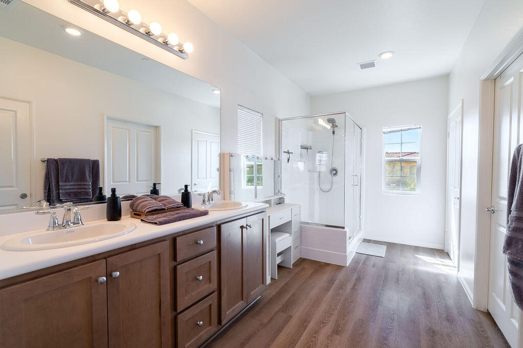 67470 Rio Naches Road Cathedral City, CA 92234 - Photo 14 of 32 a bathroom with double vanity and a mirror