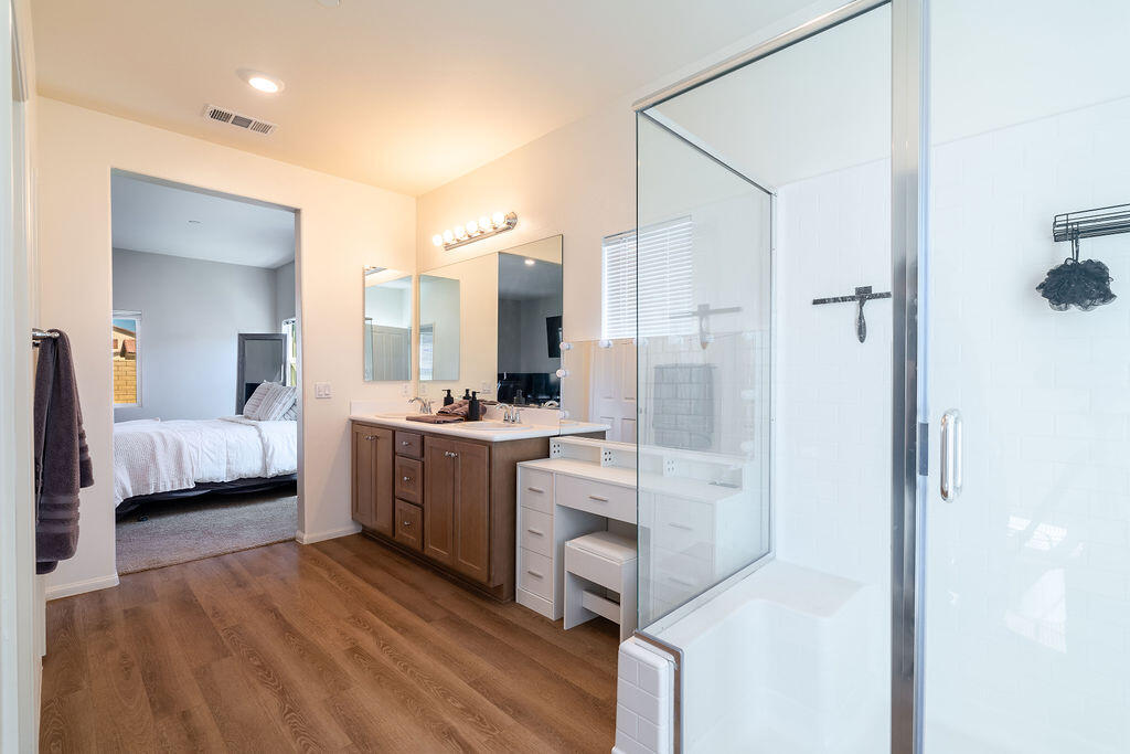 67470 Rio Naches Road Cathedral City, CA 92234 - Photo 15 of 32 a bathroom with a double vanity sink mirror and shower