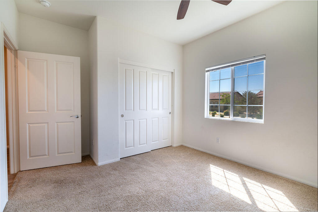 67470 Rio Naches Road Cathedral City, CA 92234 - Photo 17 of 32 an empty room with windows