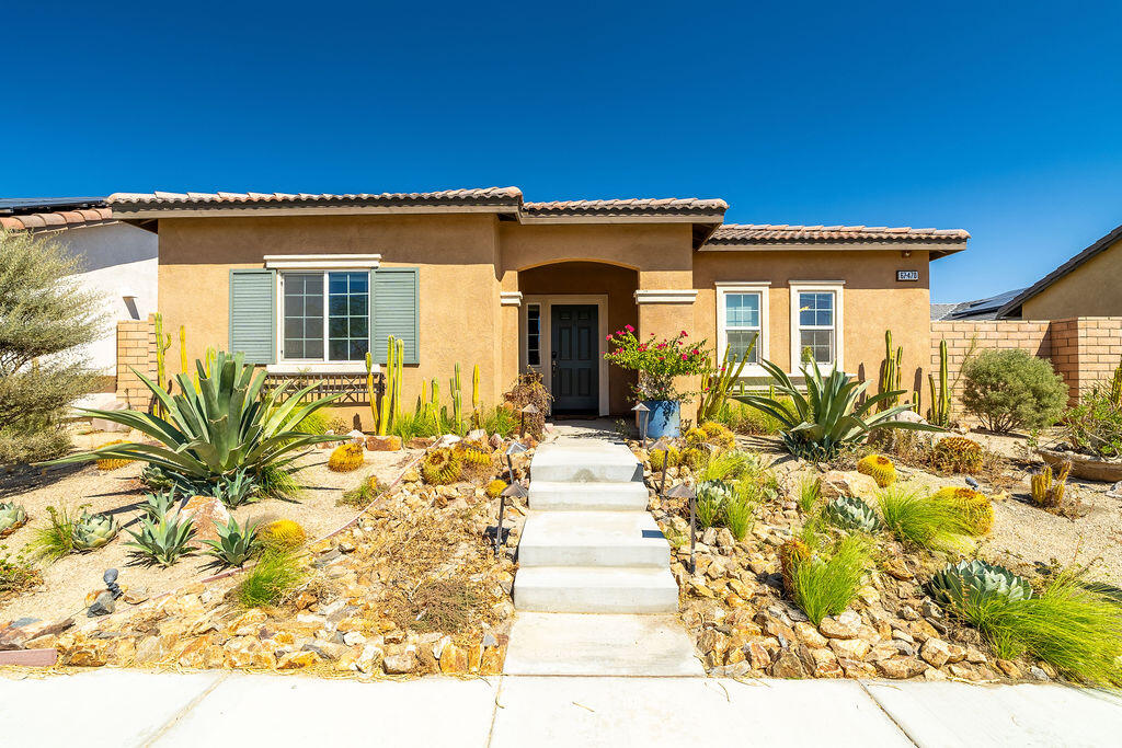67470 Rio Naches Road Cathedral City, CA 92234 - Photo 2 of 32 a front view of a house with a yard