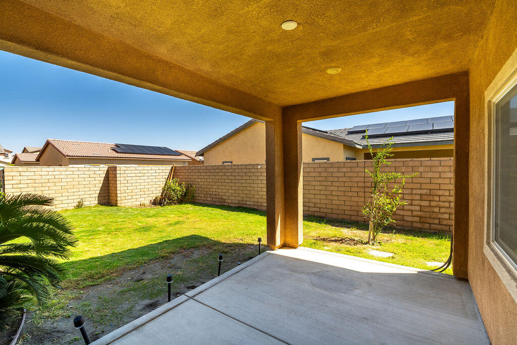 67470 Rio Naches Road Cathedral City, CA 92234 - Photo 21 of 32 a view of a swimming pool with an outdoor space and seating area