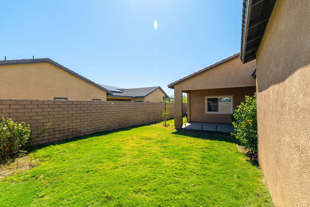 67470 Rio Naches Road Cathedral City, CA 92234 - Photo 22 of 32 a view of backyard with a garden and plants