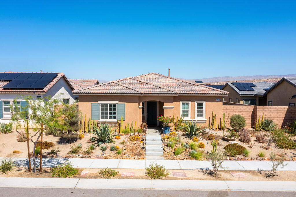 67470 Rio Naches Road Cathedral City, CA 92234 - Photo 23 of 32 a front view of a house with garden