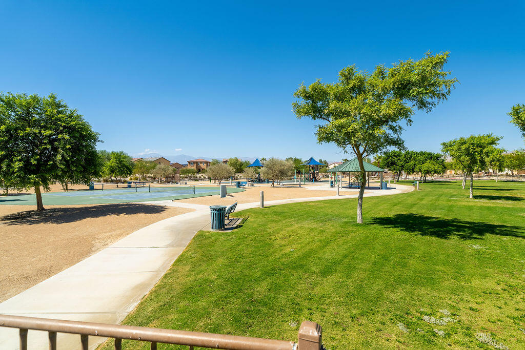 67470 Rio Naches Road Cathedral City, CA 92234 - Photo 29 of 32 a swimming pool with lots of trees in the background