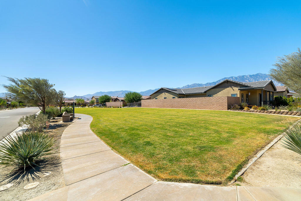 67470 Rio Naches Road Cathedral City, CA 92234 - Photo 32 of 32 a swimming pool with lawn chairs