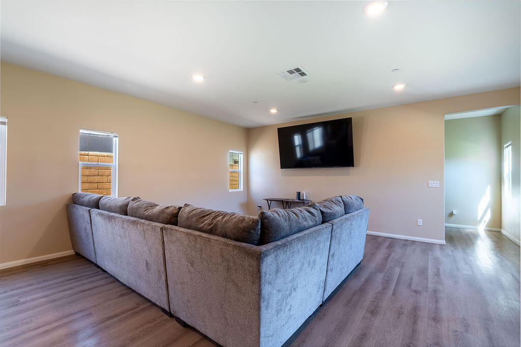 67470 Rio Naches Road Cathedral City, CA 92234 - Photo 8 of 32 a living room with furniture and a flat screen tv
