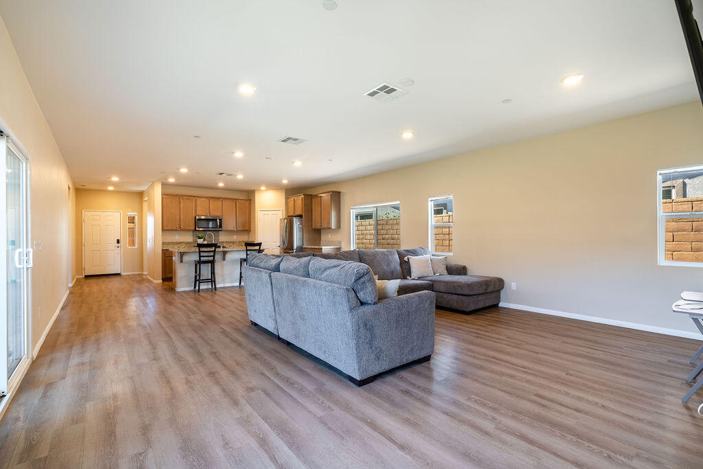 67470 Rio Naches Road Cathedral City, CA 92234 - Photo 9 of 32 a living room with furniture and a wooden floor