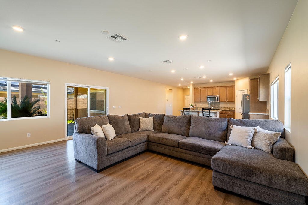 67470 Rio Naches Road Cathedral City, CA 92234 - Photo 10 of 32 a living room with furniture and wooden floor