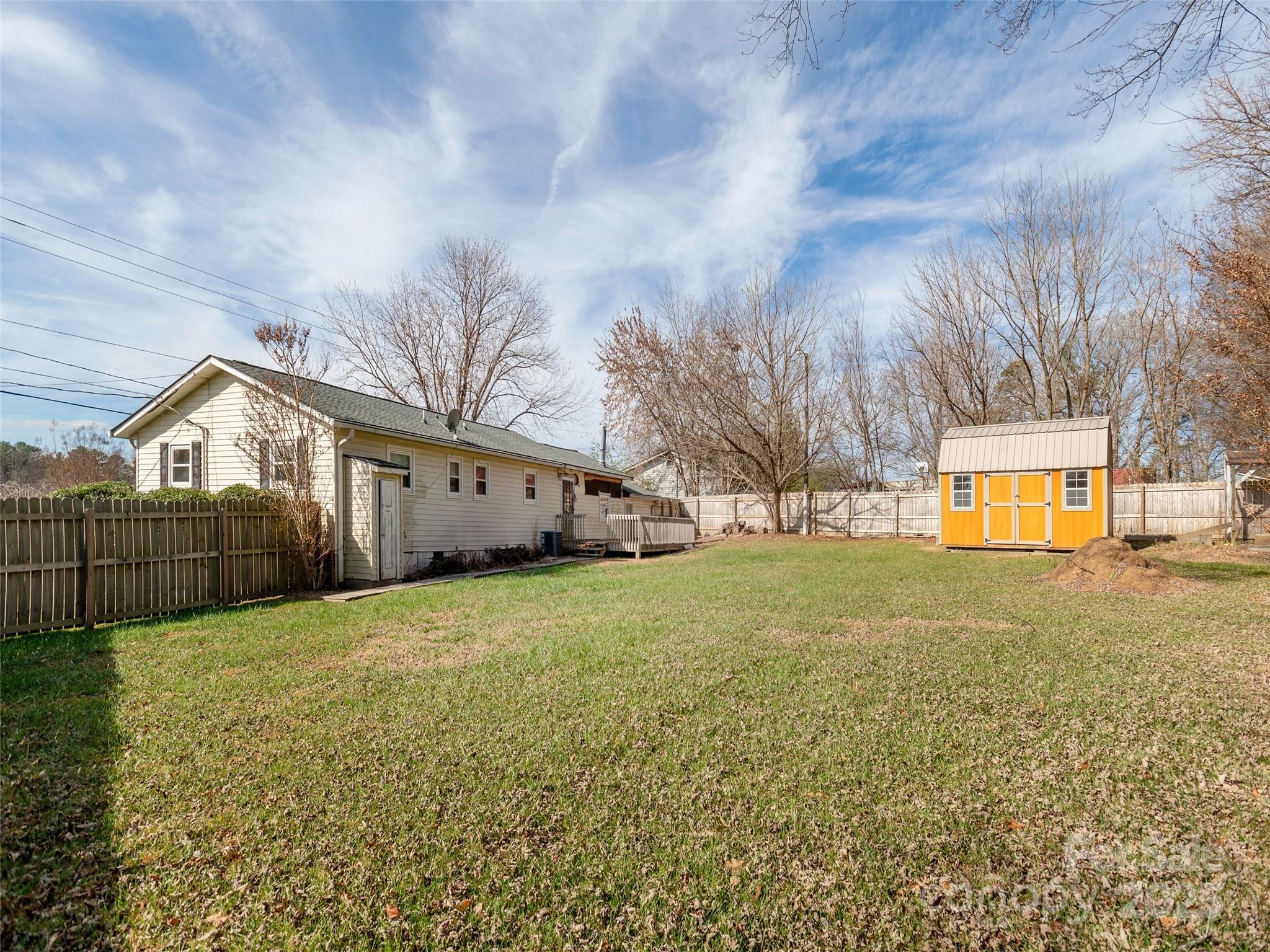 5057 Howard Gap Road Flat Rock, NC 28731 - Photo 18 of 19 a view of a back yard of the house and front view of a house