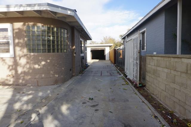 44822 Genoa Avenue Lancaster, CA 93534 - Photo 17 of 27 a view of a house with a small yard