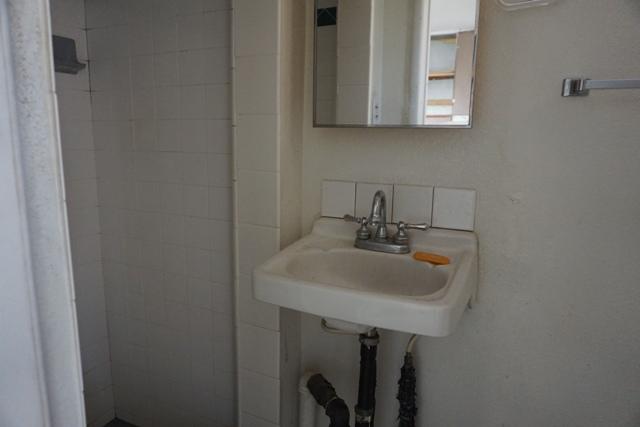 44822 Genoa Avenue Lancaster, CA 93534 - Photo 22 of 27 a bathroom with a sink and a mirror