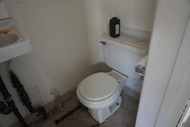 44822 Genoa Avenue Lancaster, CA 93534 - Photo 23 of 27 a bathroom with a toilet and a sink