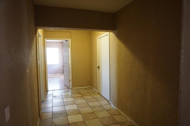 44822 Genoa Avenue Lancaster, CA 93534 - Photo 9 of 27 a view of a bathroom with a glass door