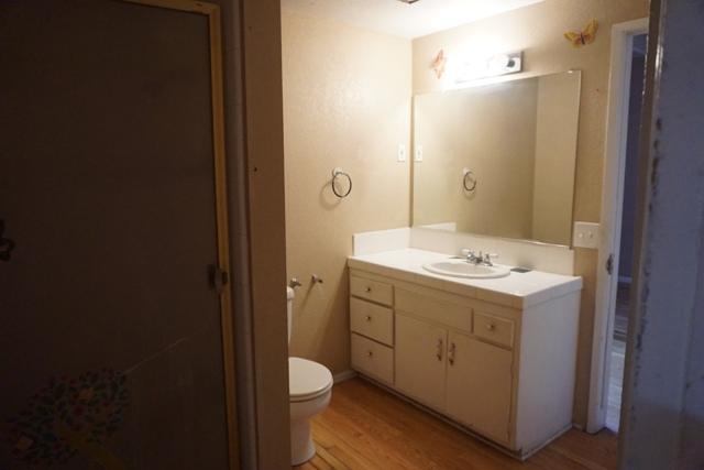 44822 Genoa Avenue Lancaster, CA 93534 - Photo 10 of 27 a bathroom with a sink a toilet and shower
