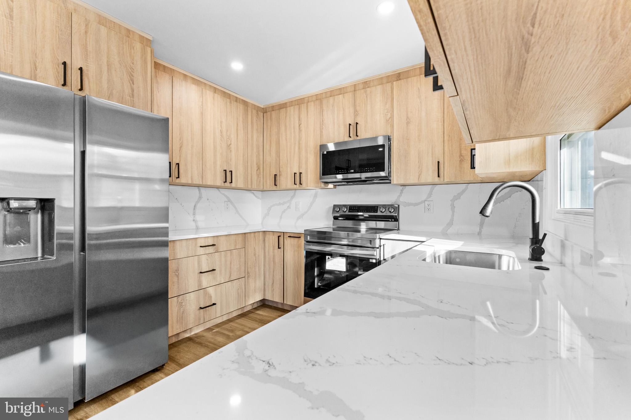 5 Perennial Lane Willingboro, NJ 08046 - Photo 18 of 52 a kitchen with stainless steel appliances a refrigerator sink and microwave