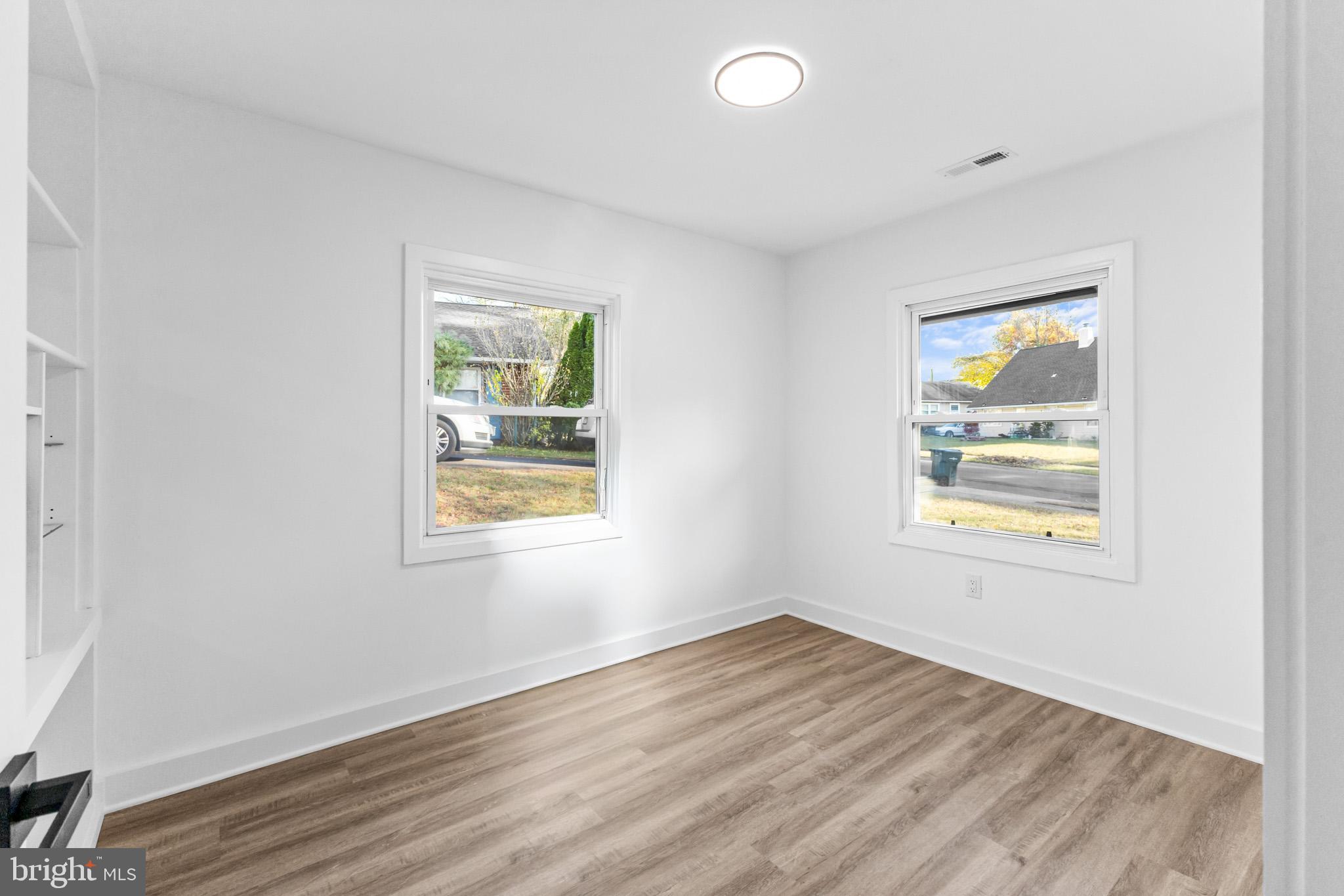 5 Perennial Lane Willingboro, NJ 08046 - Photo 19 of 52 a view of an empty room with wooden floor and a window